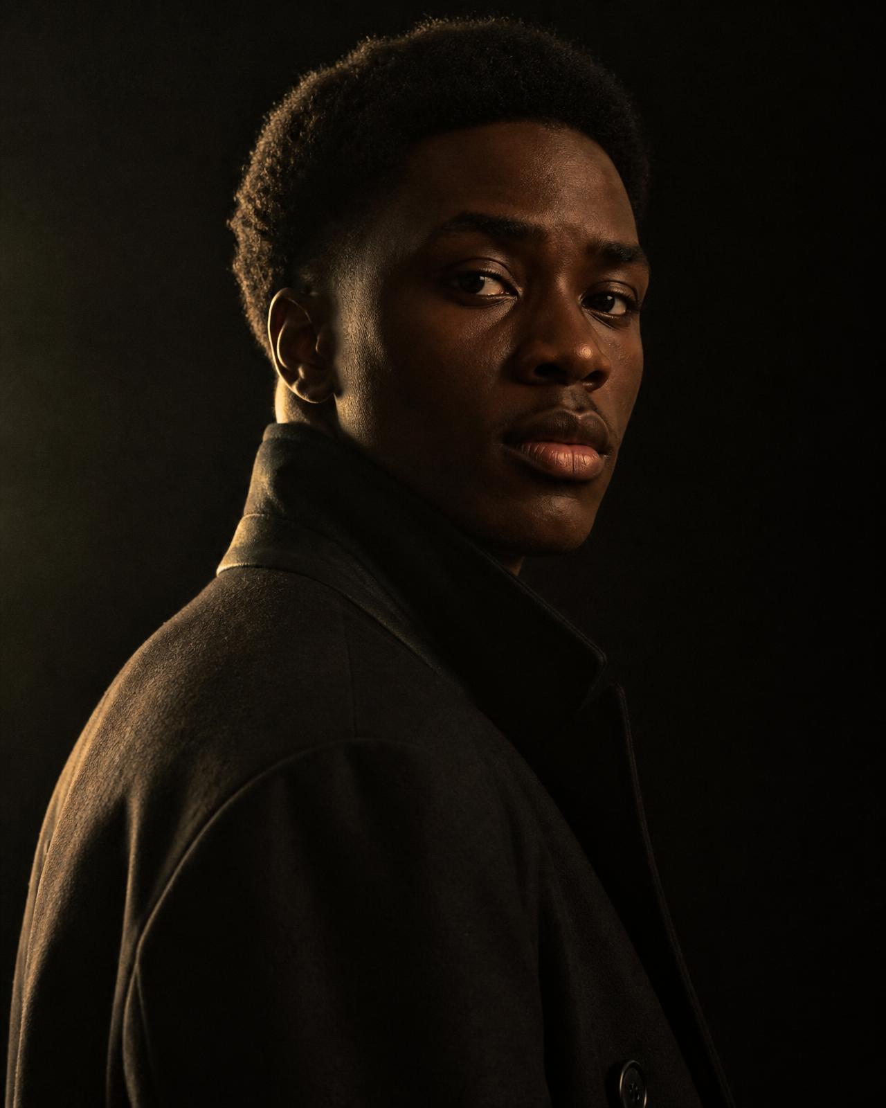 A young man in an overcoat